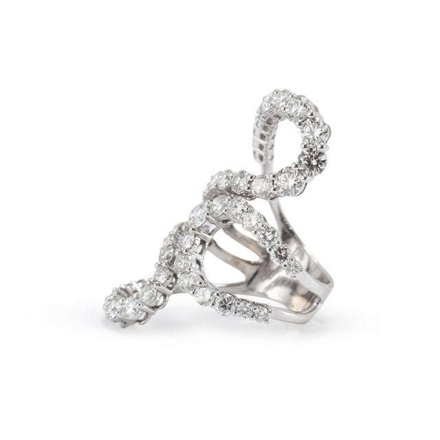 Gender: Ladies Metal Type: 18K White Gold Ring Size: 8.5 Thick: 7.30 mm Head: 24.30 mm by 1.75 inches Weight: 12.11 grams...