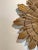 Unusual, Beautifully wood carved and giltwood mid century vintage sunburst mirror, with hidden clock face. Hands are...