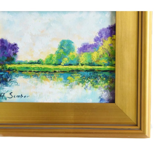 Serene lake and landscape impressionist oil painting on artist's stretched canvas. Illegible signature lower left....