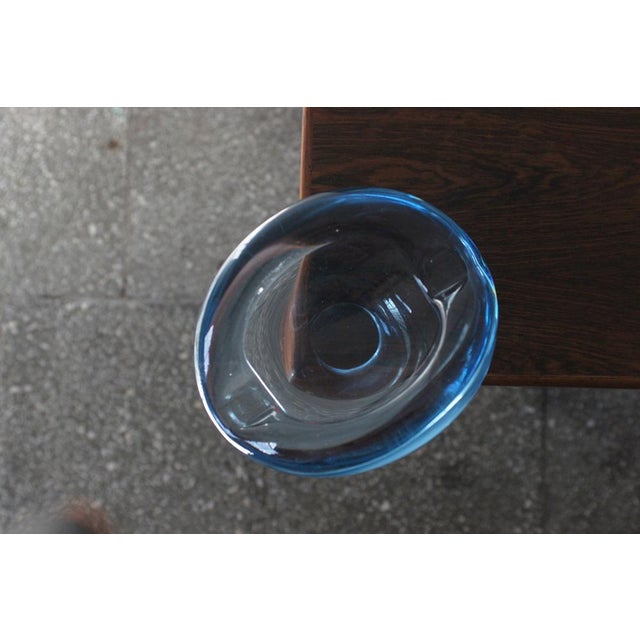 A stunning glass bowl designed by Per Lütken for the legendary Danish glassworks Holmegaard. Made of clear glass in a cool...