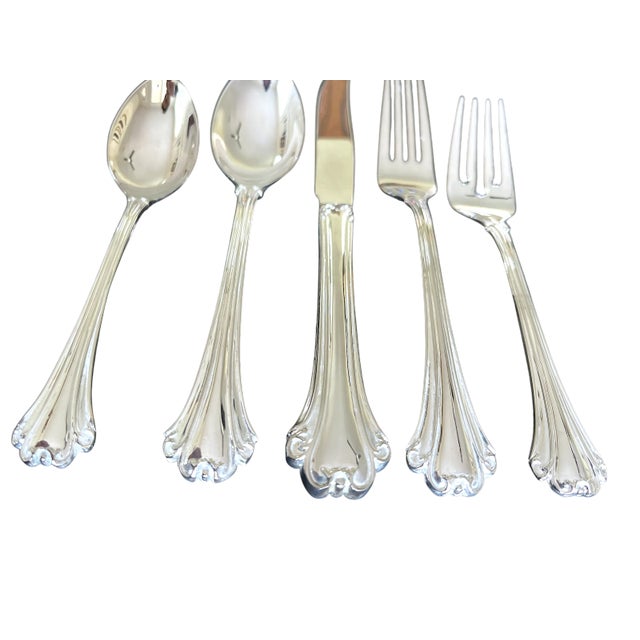 A timeless flatware service in the elegant American Chippendale pattern by FB Rogers Silver Co., this 62-piece set serves...