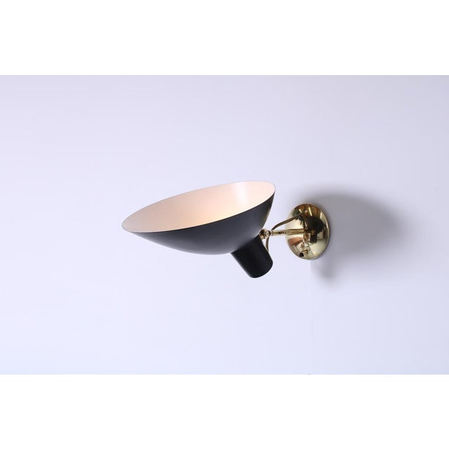 Original fifties production 'visor' wall lamp by vittoriano vigano for arteluce. black aluminium shade, brass wall...
