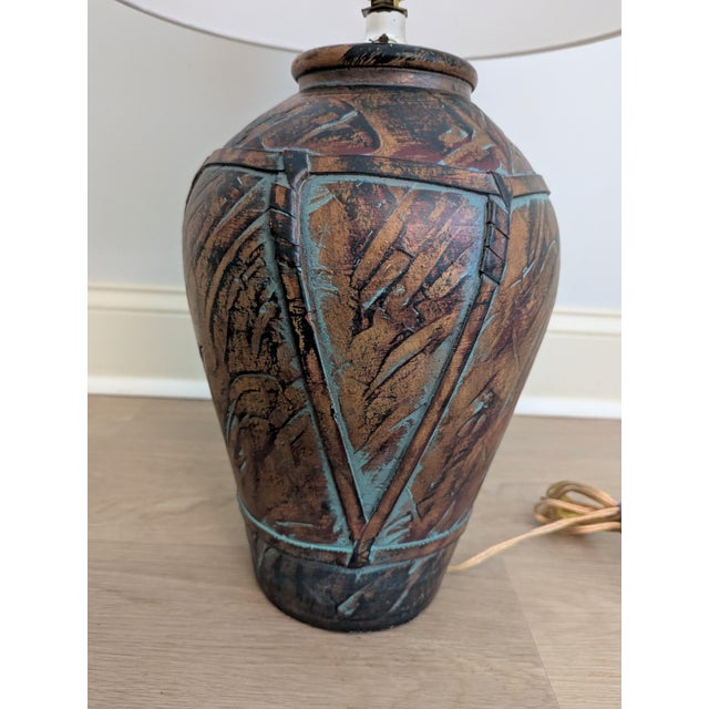 Bring organic texture and late-century character to your space with this striking postmodern table lamp manufactured by...