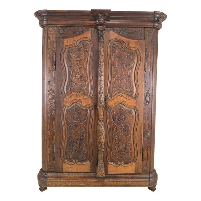 French Carved Oak and Walnut Armoire with Mask and Cartouches, 1700s For Sale
