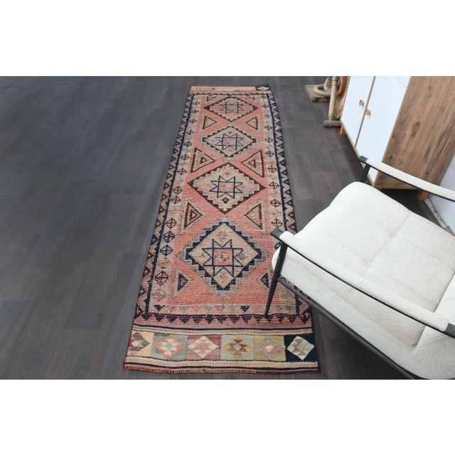 Vintage Turkish Hand-Knotted vintage rug is a semi- vintage runner rug.'70s Eastern region of Turkey's unique rug is...