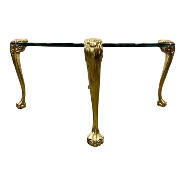 This is an Italian coffee table in the Hollywood regency style, attributed to designer P.E. Guerin. The piece features...