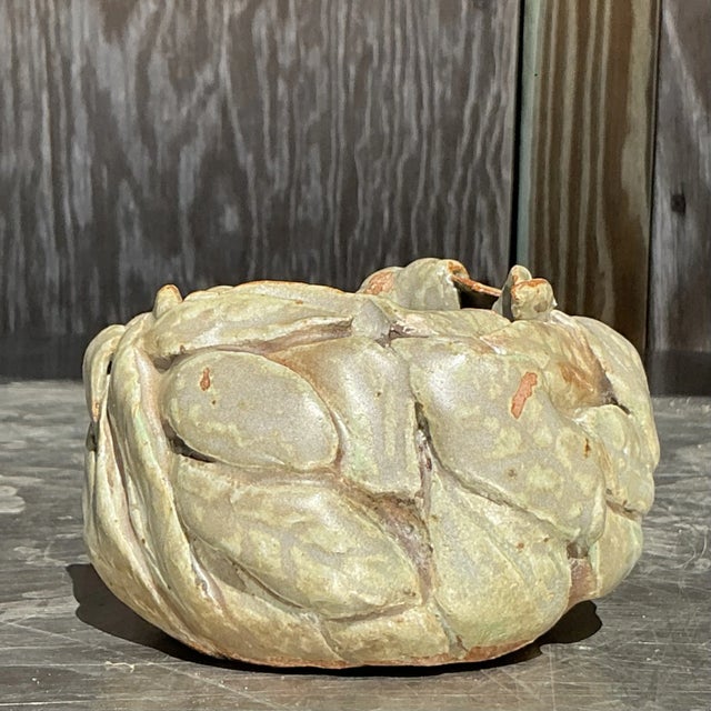 Embrace natural beauty with this vintage Boho studio pottery bowl, featuring intricate, hand-carved leaf designs. Its...