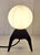 Mid-Century Table Lamp with a Black Iron Tripod Base and a White Opal Glass Shade, 1960s, in Very Good conditions....