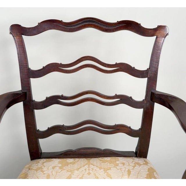 Antique early 19th century English George III carved mahogany ribbon back arm chair, circa 1800. Elegant proportion with...
