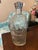 A handsome vintage Canadian liquor decanter bottle featuring an elegant paneled silhouette with embossed diamond and...