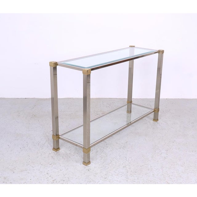 Vintage console table designed by pierre vandel, produced in france in the 1970s. The console is made of silver-plated and...