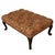 A beautifully proportioned upholstered ottoman raised on carved mahogany cabriole legs terminating in scroll feet. The...