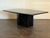 1980's postmodern black marble coffee table in good vintage condition. Small chips on the base. Minor scratches. Unsigned....