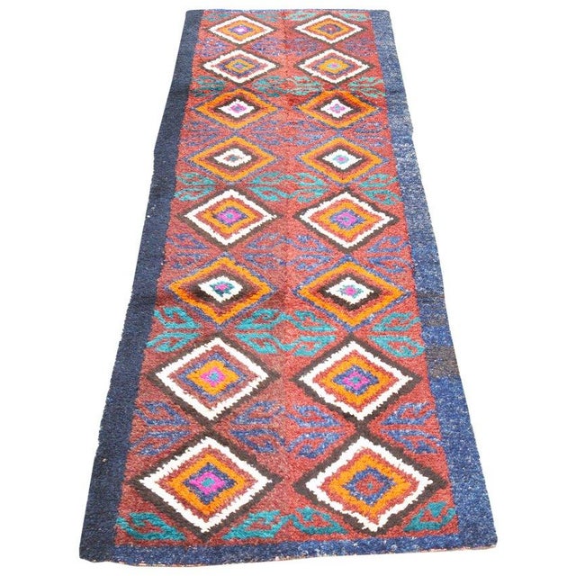 Hand-knotted with care using traditional rug-making techniques, this wool rug blends timeless craftsmanship with a modern...