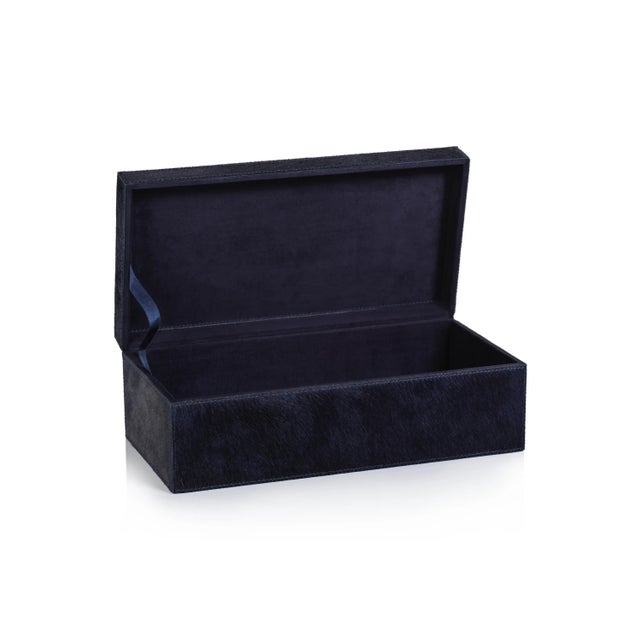 Stay organized without sacrificing beauty or quality. The hair-on-hide leather exterior of our decorative box looks great...