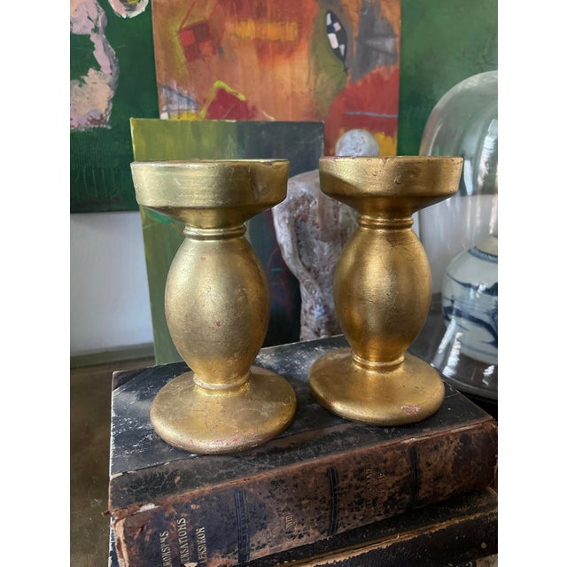 Lovely pair of ceramic candlesticks, made in Italy, each holds a 3 inch pillar candle. The ceramic has gilt applied all...
