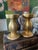 Lovely pair of ceramic candlesticks, made in Italy, each holds a 3 inch pillar candle. The ceramic has gilt applied all...