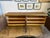Custom sideboard buffet with two cabinets, each with three shelves that provide ample storage. The four panels on the...