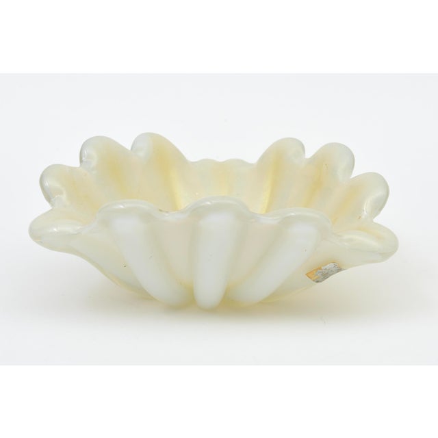 This beautiful vintage Italian Murano large glass bowl is opalescent with gold aventurine. It has a clam shell design and...