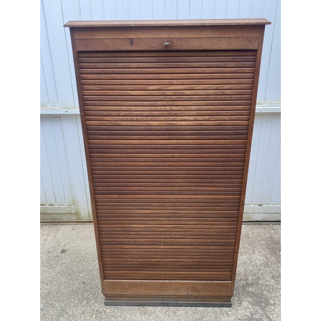 Beautiful vintage cabinet, 1950s roll-top filing cabinet in oak and oak veneer In good overall condition, the roll-top...