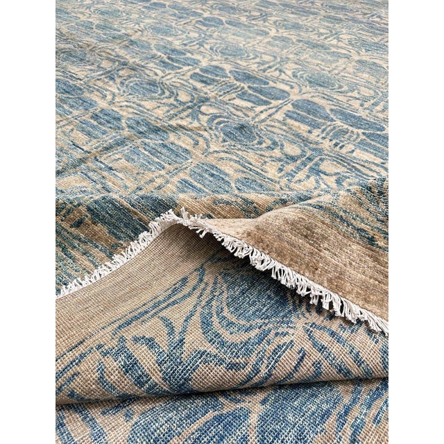 Transform your home with a 12x18 Modern Tribal Area Rug from Pakistan. Its captivating design adds a touch of modern...