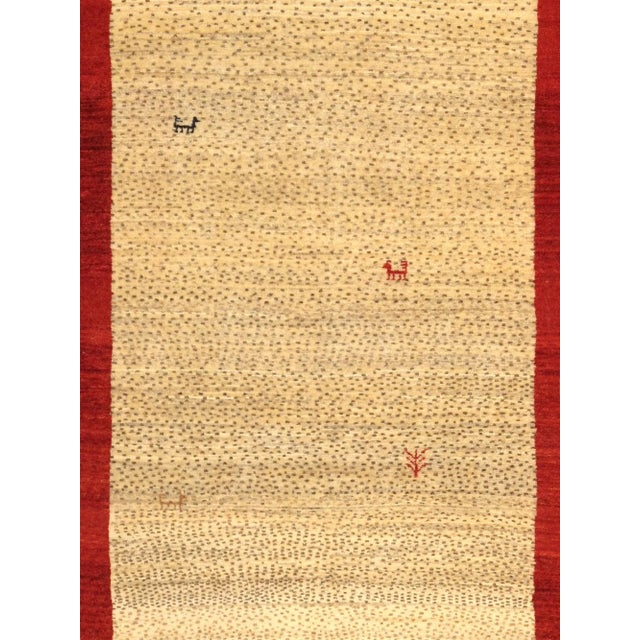 Gabbeh Hand-Knotted Area Rug is handmade with extra high pile and very simple, stylized designs. They are constructed from...