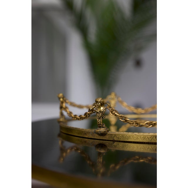 This exquisite vintage vanity tray is crafted in richly toned antique gold ormolu, showcasing timeless European elegance...