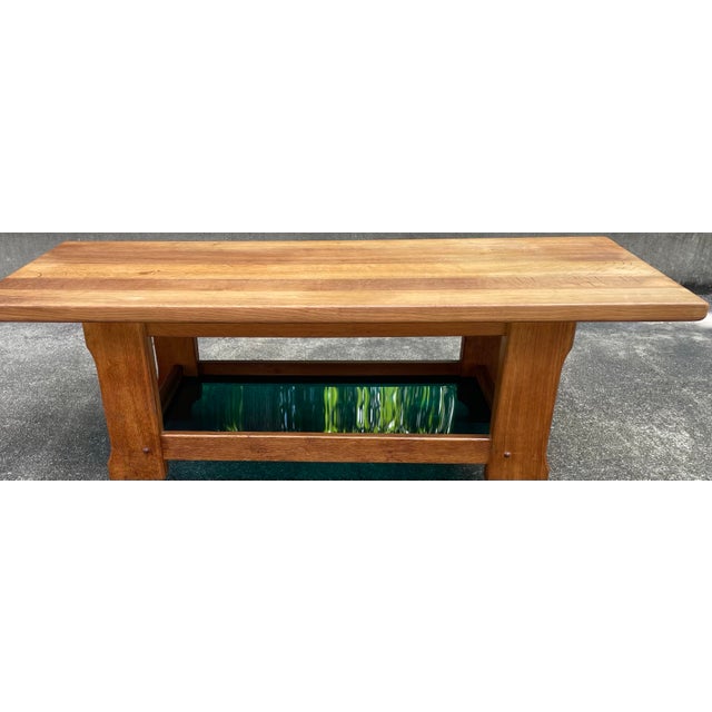 Mid century coffee table with green plexiglass bottom shelf