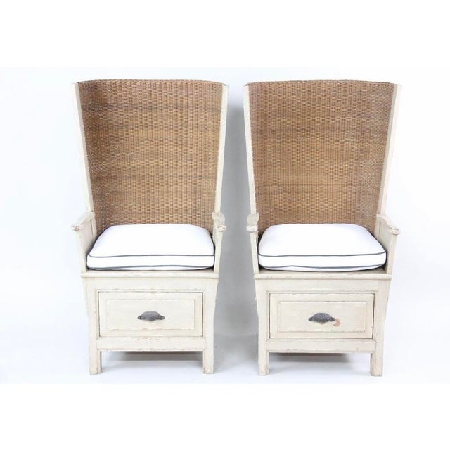 A fun pair of warming chairs with wooden frames, handwoven straw backs and a drawer in the lower section. The chairs have...