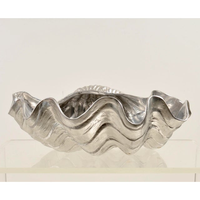 Arthur Court is well known for producing whimsical serving pieces. This example is a very large clam shell in aluminum....