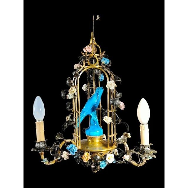 XIX Century lamp in the shape of a cage. Elegant 19th century lamp in the shape of a cage decorated with porcelain flowers...