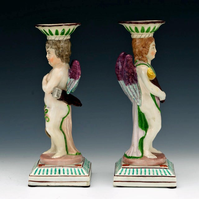 Pair of English Pearlware Cupid and Torchbearer Figural Candlesticks, Attributed to Neale & Co. or Wilson Circa 1800...