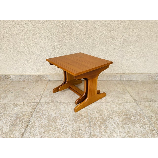 A lovely pair of scandinavian nesting teak coffee tables dating from the 1960s. their minimalist design highlights the...