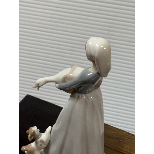 Design Plus Gallery presents the Porceline Figurine Girl with Goose and Dog by the Fulgencio García for Lladró. This...