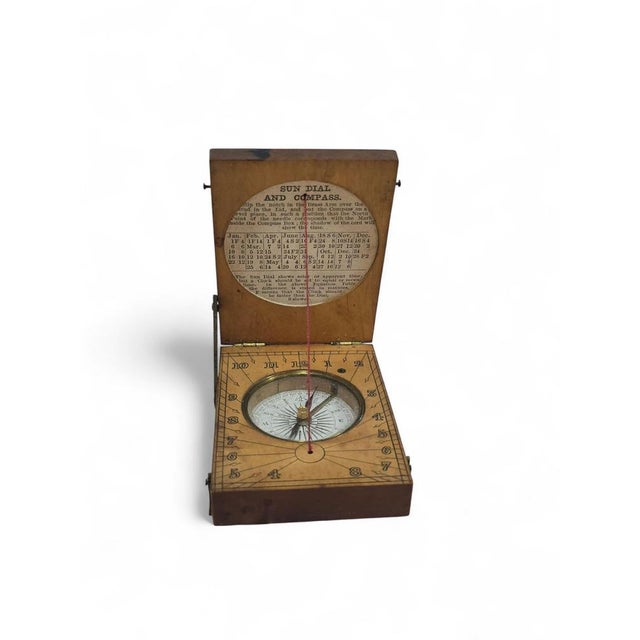 Charming portable sundial crafted in engraved wood, dating from the 19th century. This compact timekeeping instrument...