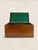 A handsome antique English oak storage box dating to circa 1910, featuring a rich timeworn patina and a traditional green...