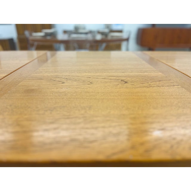 The teak wood Refectory Dining Table with Two Leaves is a quintessential piece of Mid-Century Modern Scandinavian design,...
