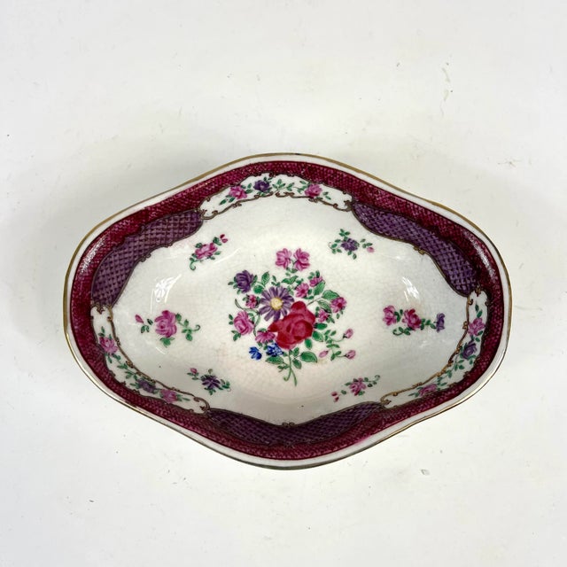 A shallow bowl for decorative purposes only. This is completely hand painted in intricate detail. The bottom shows a stamp...