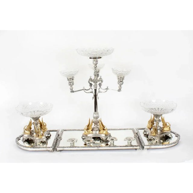 This is a fabulous stunning and thoroughly extravagant antique Victorian silver plate and gilded centrepiece set, also...