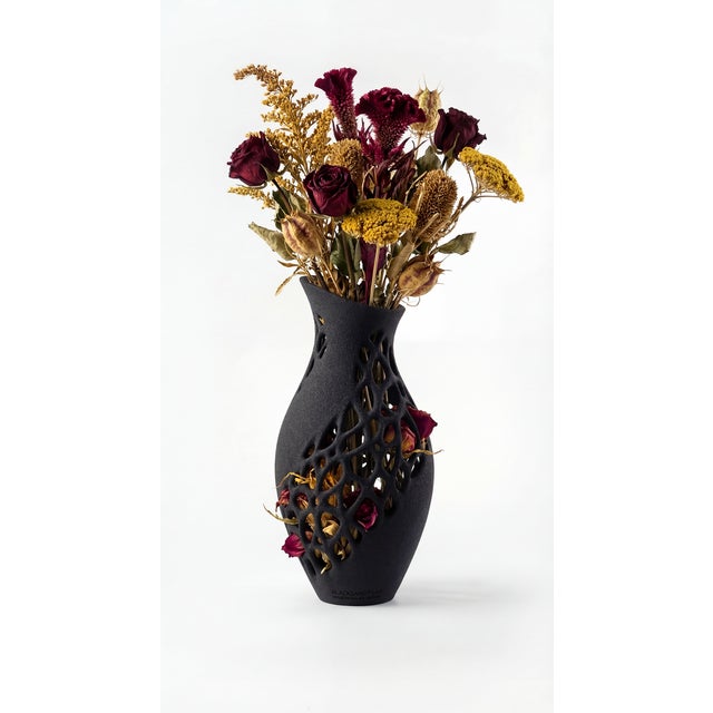 The Erode Dried Flower Vase V1 is a lattice vessel 3D-printed from black quartz sand, designed specifically for dried...