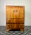 The elegant art deco drink cabinet has a stunning burr walnut finish, which gives it a beautiful, vibrant wood grain...
