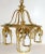 Antique, early 20th century brass chandelier having hanging tube form shades with pointed arch design frames on round...