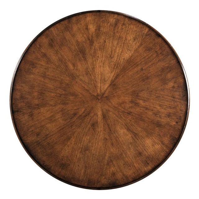 A unique robust table for an entryway or a grand bedside option featuring a round top over four squared columns, elevated...