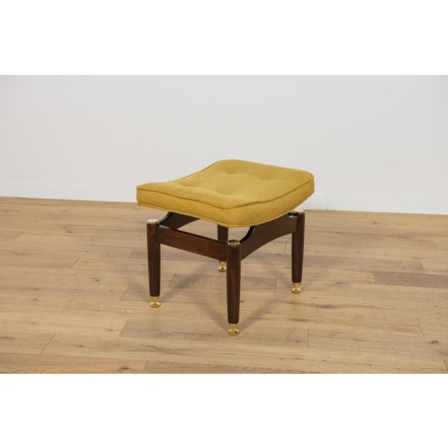 A stool from the Librenza series produced by the British G-Plan factory in the 1950s. A stool with a wooden base made of...