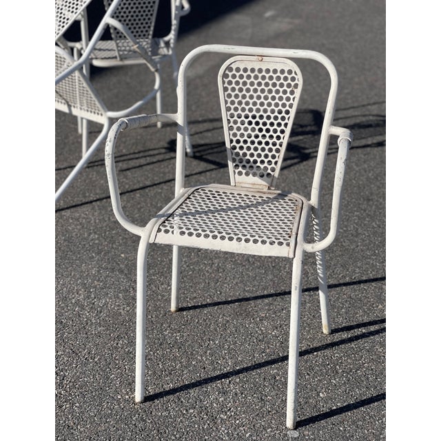 Rare René Malaval armchairs René Malaval, a welder by trade, had the idea of ​​recycling the sheet metal plates discarded...