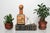 Vintage 1960's leather-wrapped Italian liquor decanter glass bottle featuring a classic golf-themed motif and a wooden...