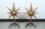 Great pair of andirons with a sunburst design. The large cast iron sunbursts have a dull gold finish and they are on black...