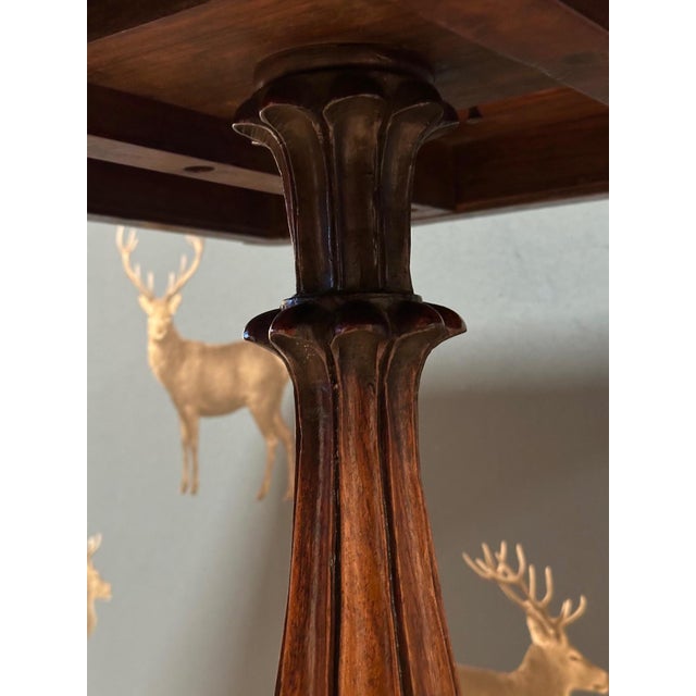 A beautiful matching pair (slight differences in the columns and the dimensions of the bases) of Anglo-Indian Padauk tilt-...