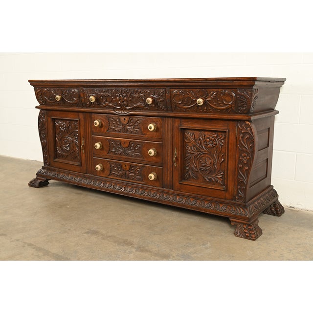 An exceptional antique Victorian or Renaissance Revival sideboard, credenza, or bar cabinet In the manner of R.J. Horner &...