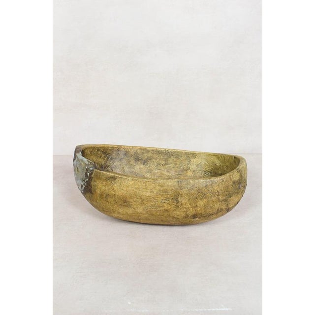 This hand-carved wooden bowl is made by the Turkana, a nomadic community in north-west Kenya prized for their woodcarving...